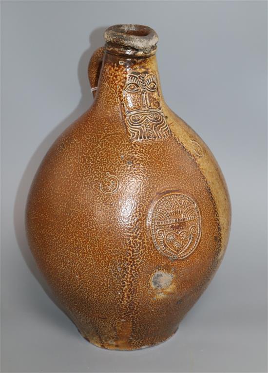 A 17th / 18th century stoneware Bellamine jug height 37cm